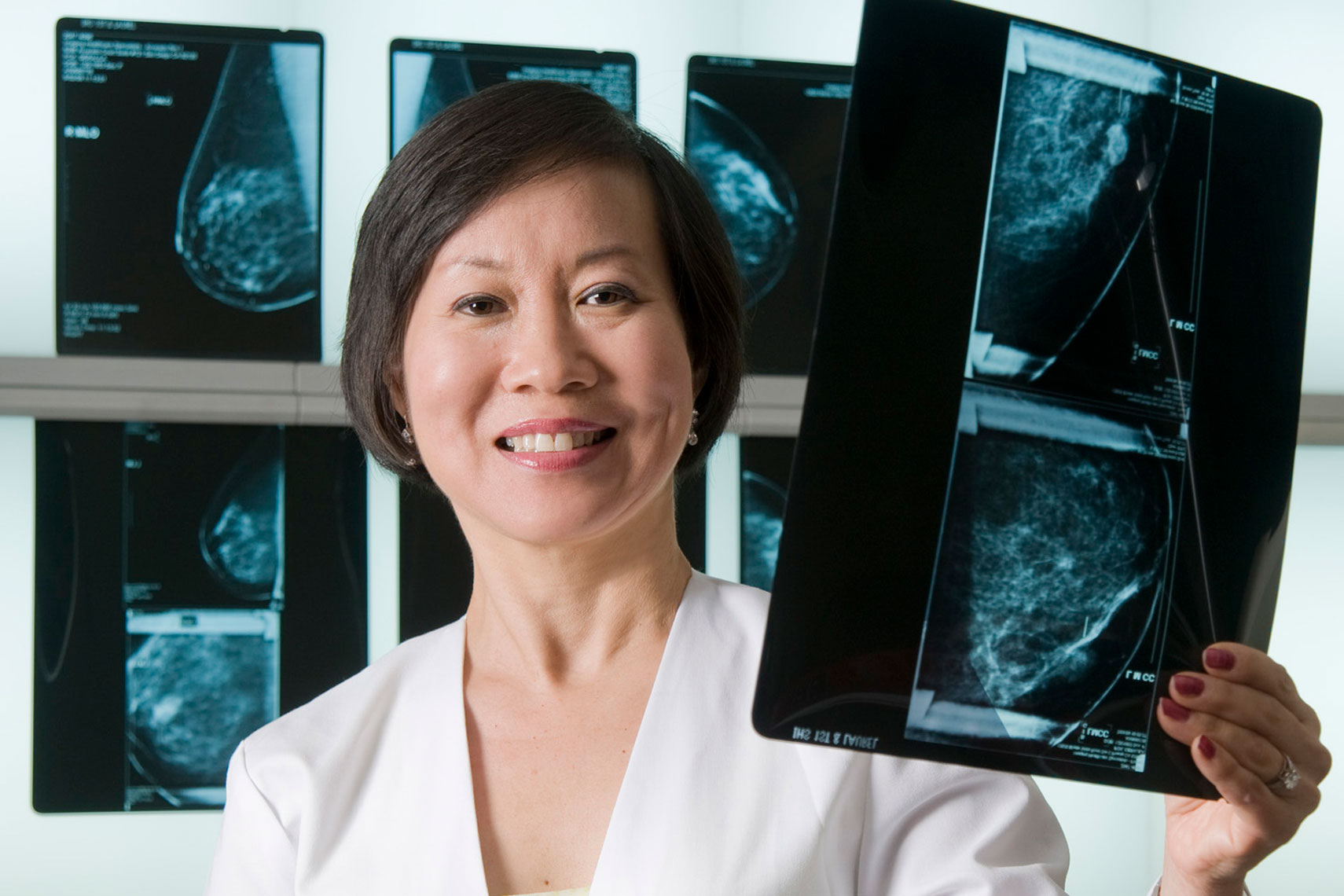 Female-doctor-of-oncology-examines-mammogram-by-environmental-portrait-photographer-Joe-Atlas.