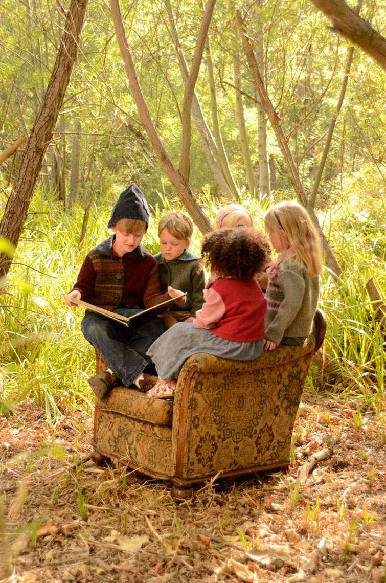 Group-of-children-reading-in-the-woods
