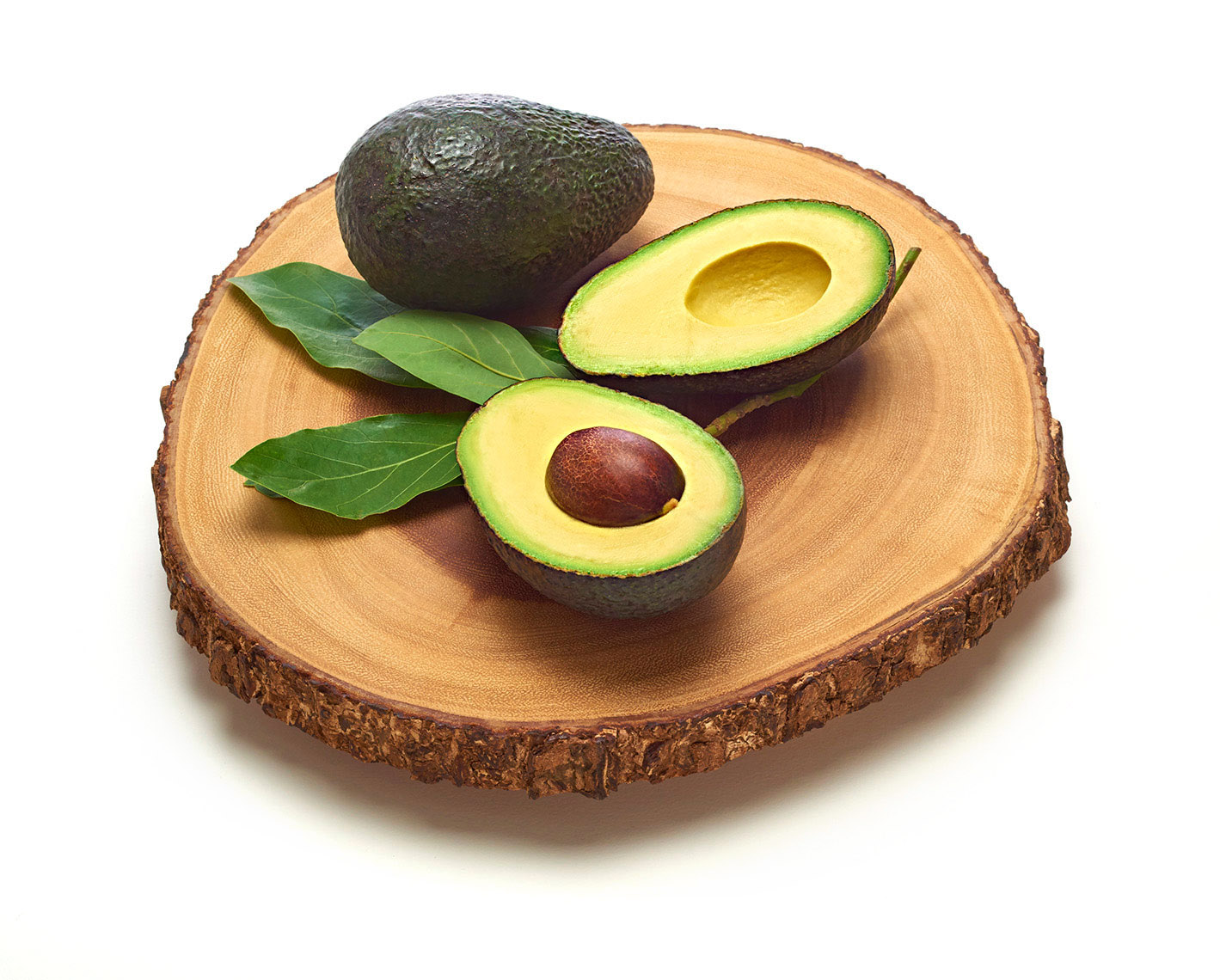 Male Hand Prepares Fresh Cut Avocado With Heart Shaped Pit Area On Wooden Cutting  Board 16357651 Stock Photo at Vecteezy